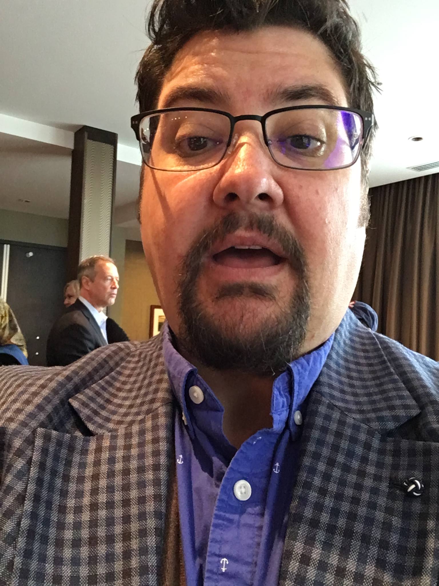 Everett being fake photobombed by Martin O'Malley